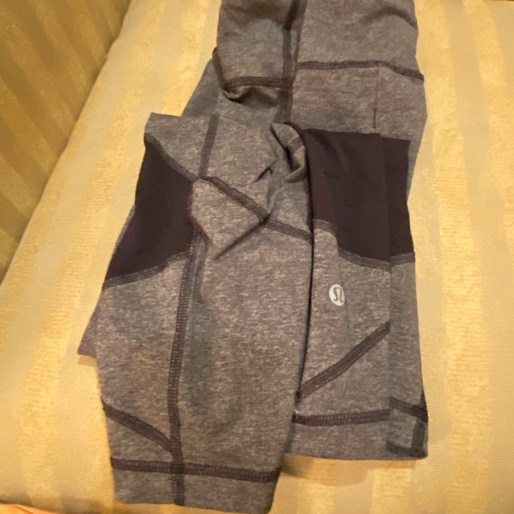 Lulu lemon gray cropped leggings.   Size 12.  Zipper on back.  Great shape